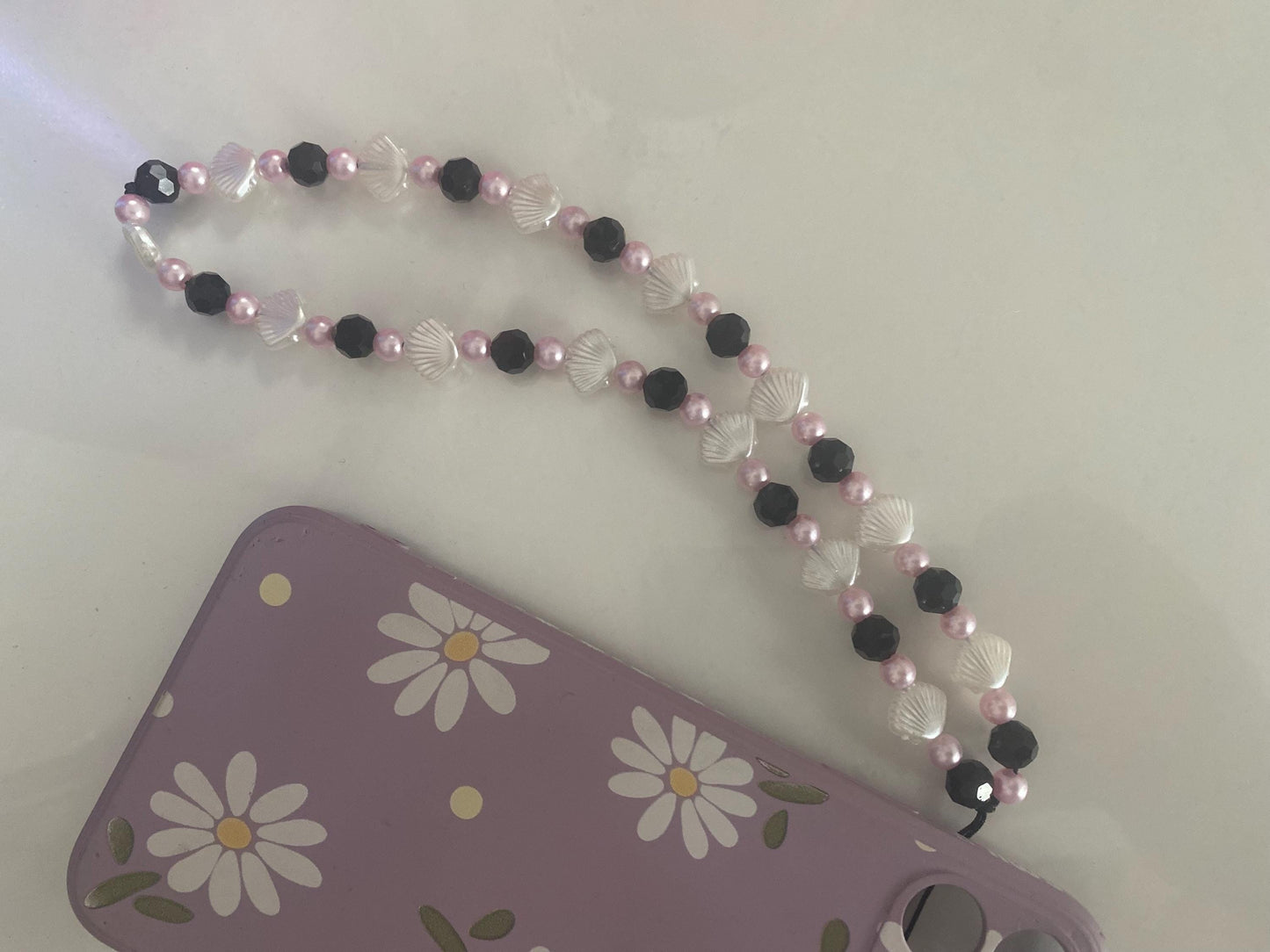 Seashell Dreams Phone Charm – Handmade Beaded Wrist Strap in Pearl Pink & Black Tones