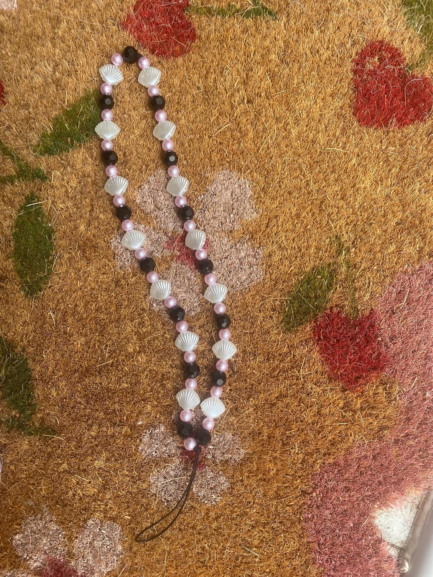 Seashell Dreams Phone Charm – Handmade Beaded Wrist Strap in Pearl Pink & Black Tones