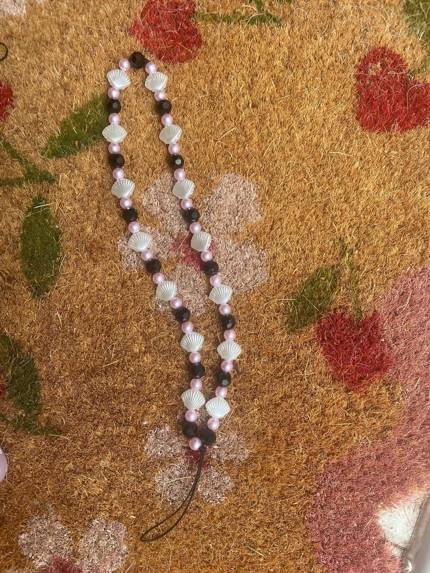 Seashell Dreams Phone Charm – Handmade Beaded Wrist Strap in Pearl Pink & Black Tones